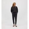 Pantalon de jogging noir pour femme resserré aux chevilles