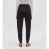 Pantalon de jogging noir pour femme resserré aux chevilles
